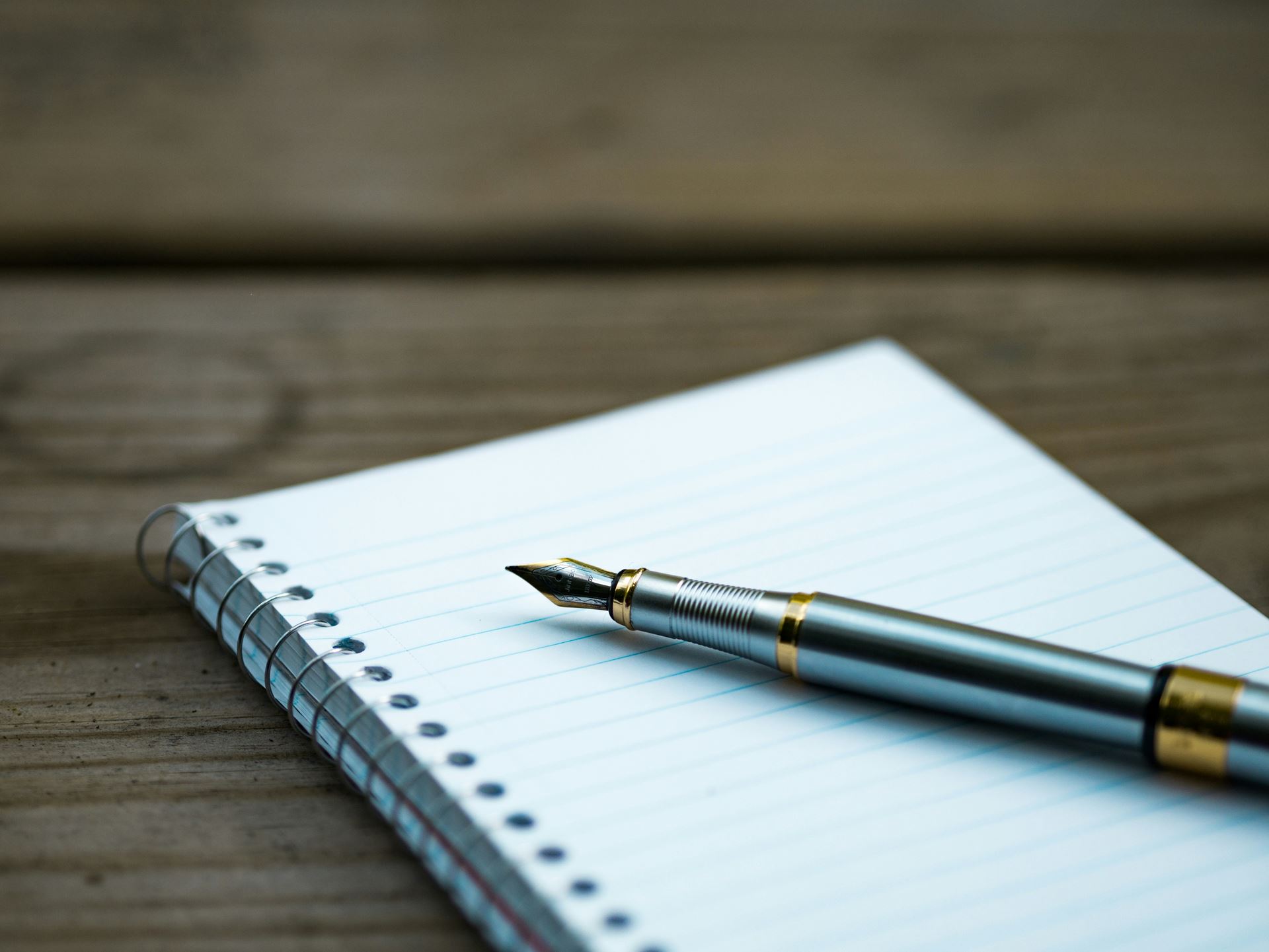 note book and pen on table 